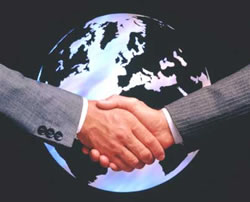 Two men shaking hands in front of a globe - Berkshire Funding Group Inc.